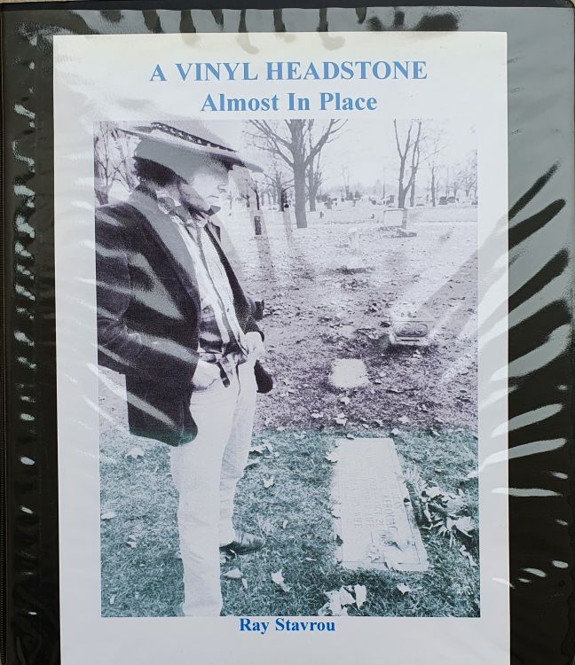 a vinyl headstone almost in place Bob Dylan book