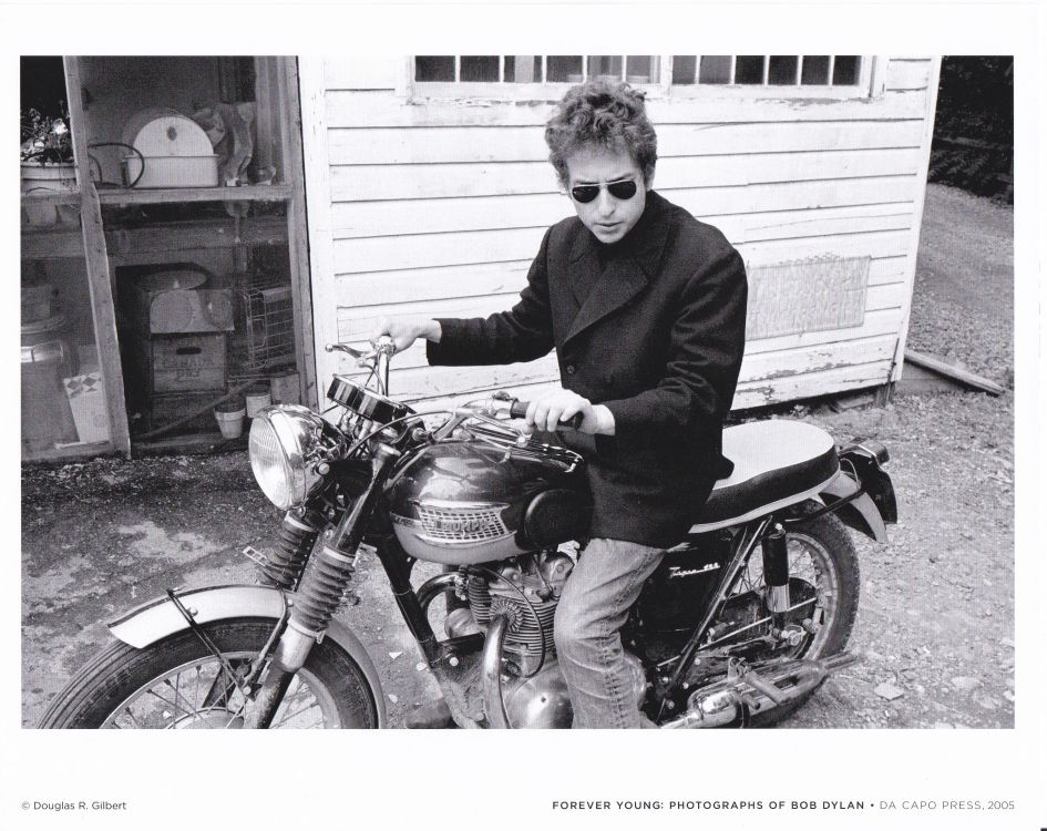 set of 4 photographs of Bob Dylan in the hardcover book